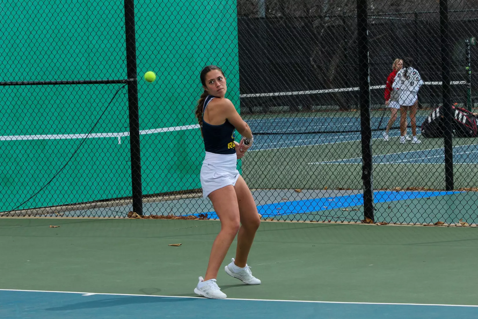 Kate Miley sets up for a backhand during her match against South Dakota. Miley won the decisive No. 4 singles point in three sets, giving Kansas City a 4-3 victory.