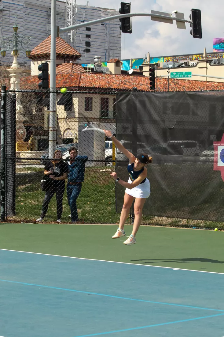 Catherine Chrobak puts a serve up in her straight-set victory at No. 2 singles.