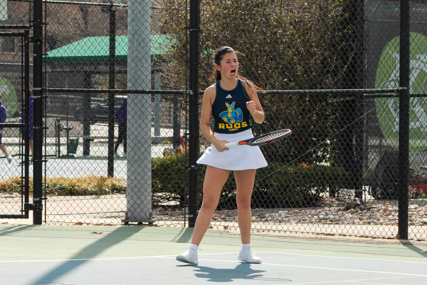 Munoz-Baroja lets out a yell of celebration after winning a point in her three-set match against South Dakota.