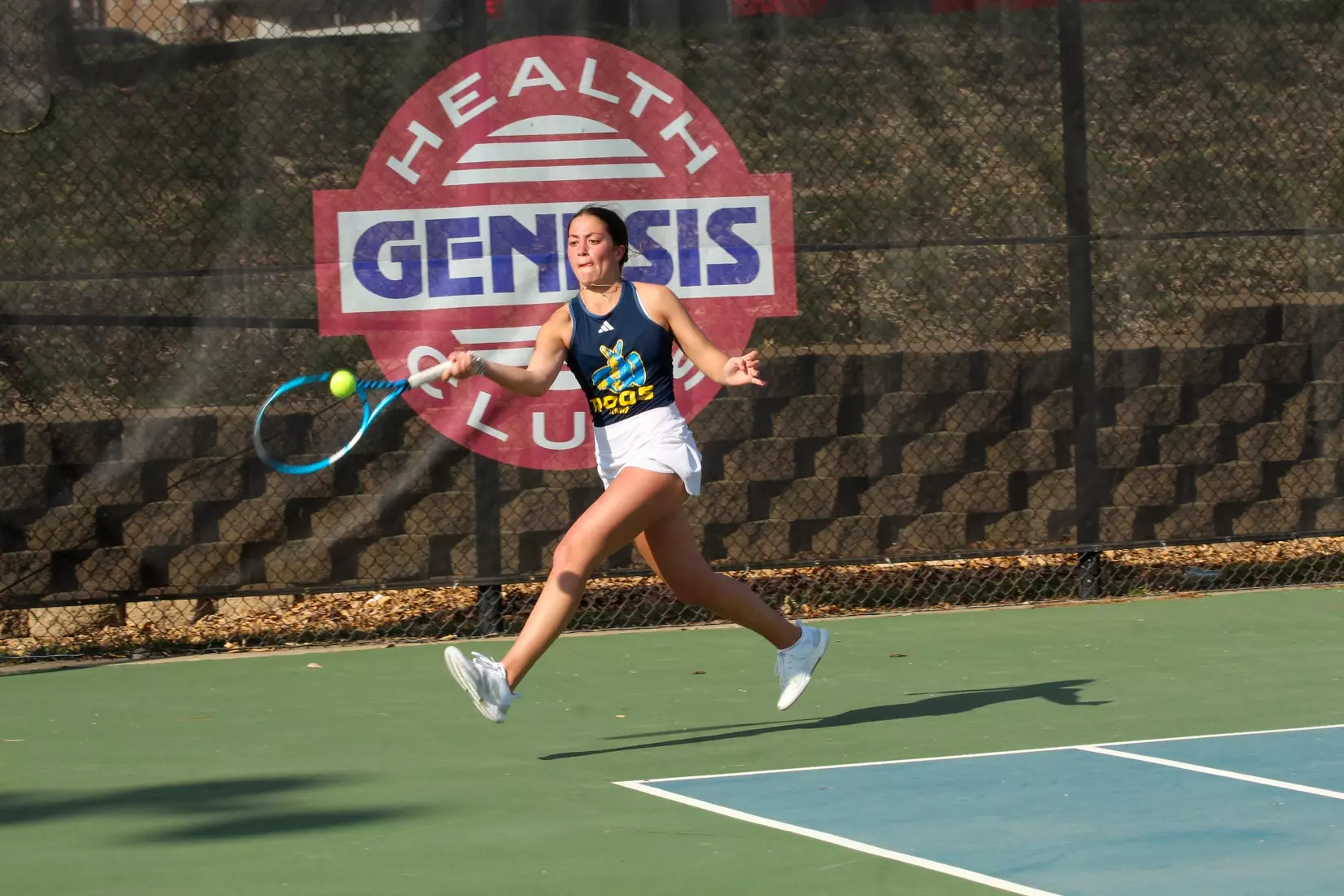 Miley swings out wide and picks up a forehand in the midst of her three-set victory.