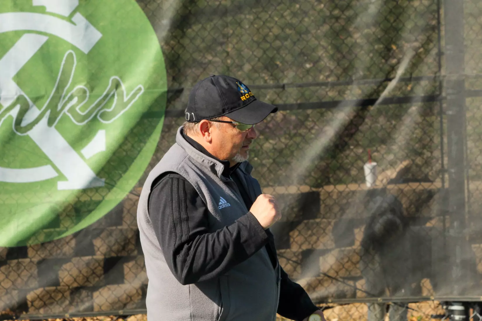Head Coach Kendell Hale celebrates after Miley picks up a service break during the third set of her singles victory.