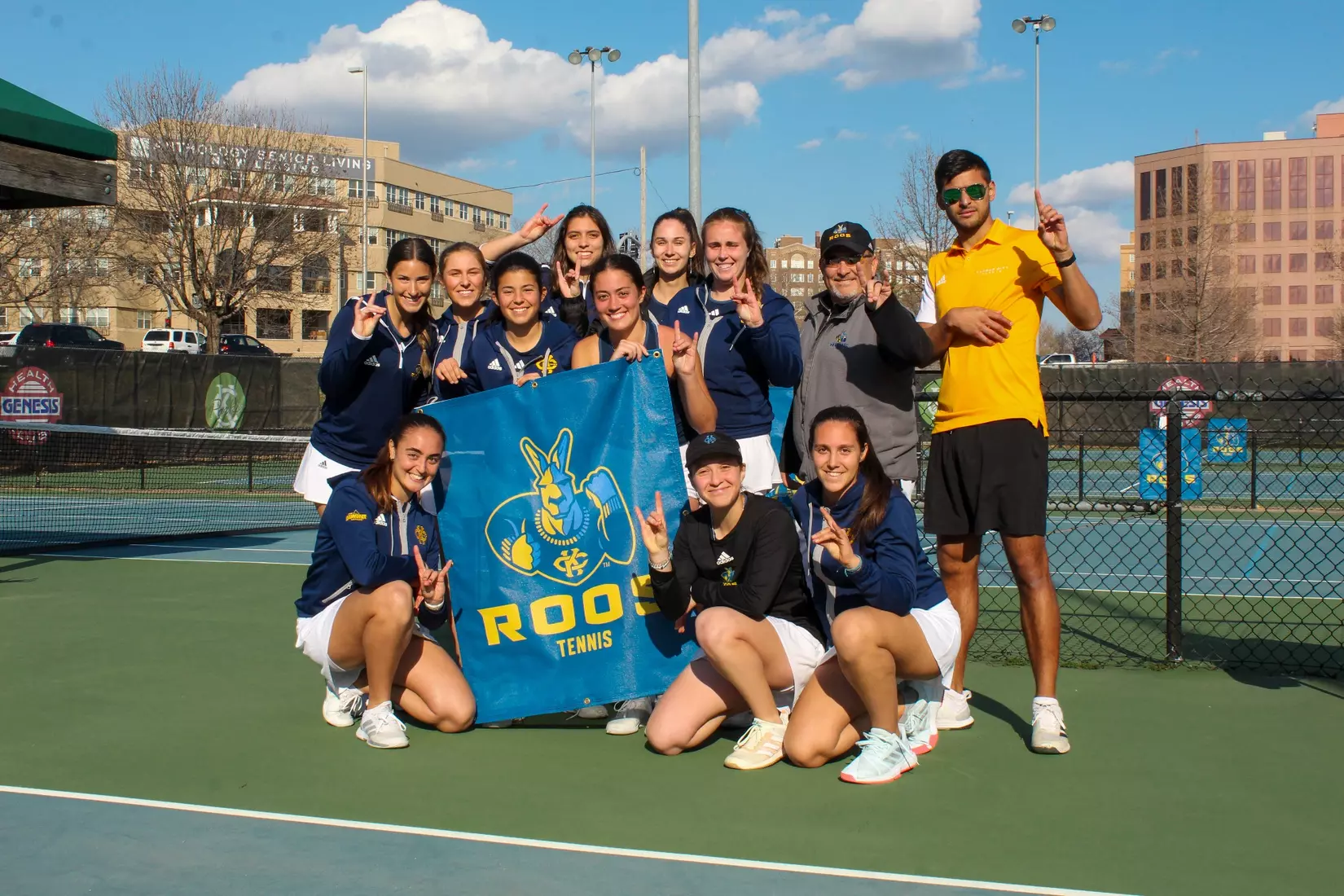 The Kansas City Tennis team poses for a picture following the Roos' 4-3 win over South Dakota. Kansas City moved to 3-0 in Summit League competition with the win.