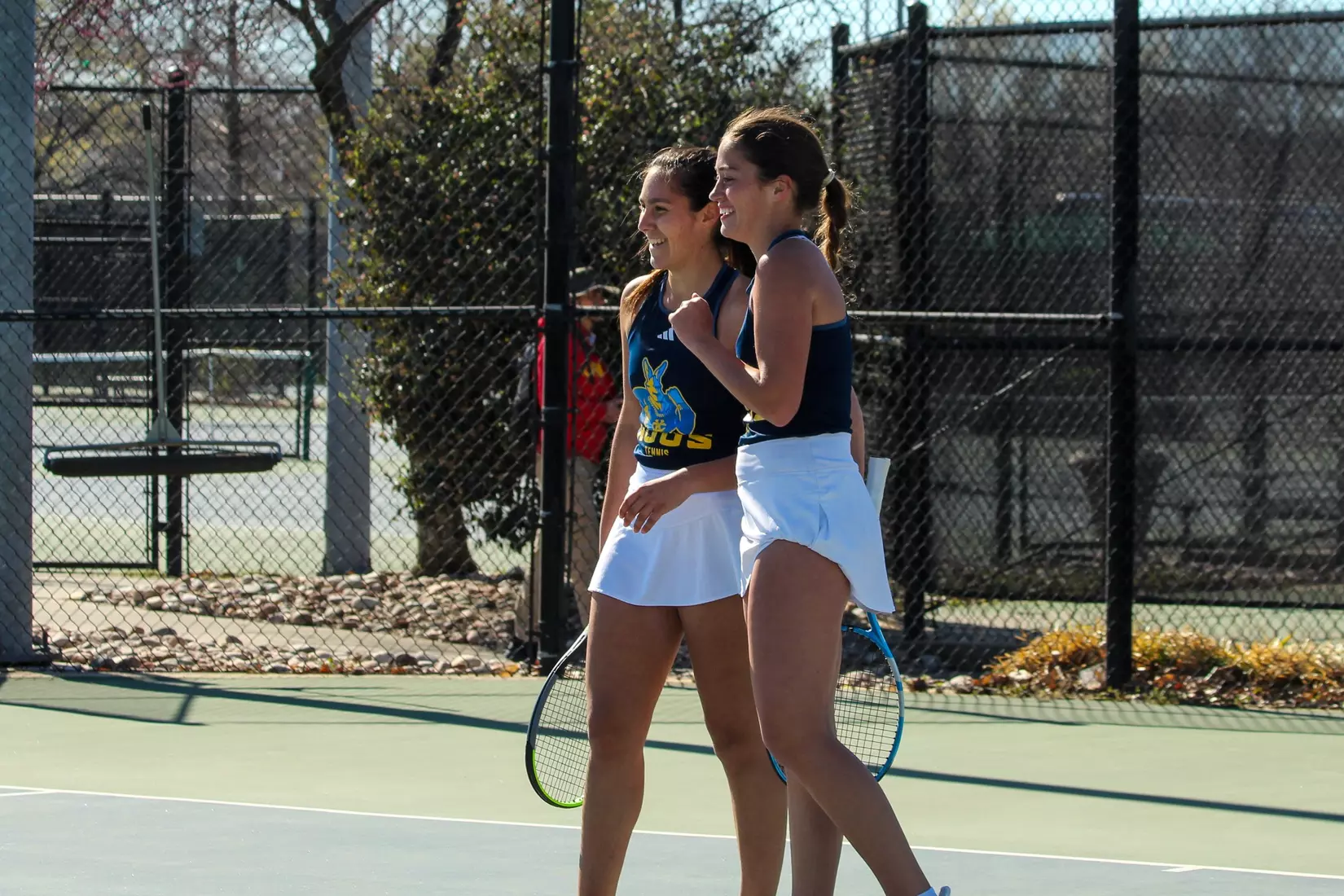 Cardona and Miley share a big smile after winning a game during the pair's No. 2 doubles match.