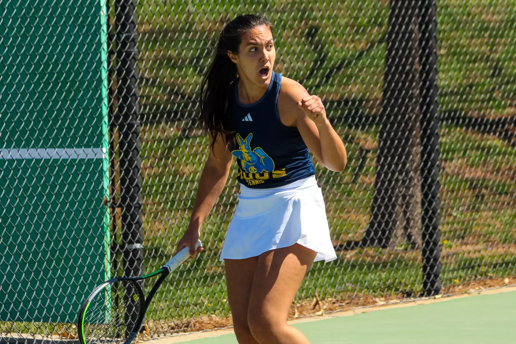 Joana Cardona celebrates after winning a point during the third set of her victory at No. 5 singles.