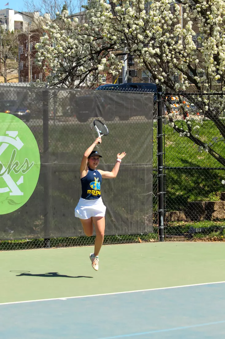 Catherine Chrobak finishes a forehand during her No. 2 singles match against North Dakota. Chrobak took a three-set victory.