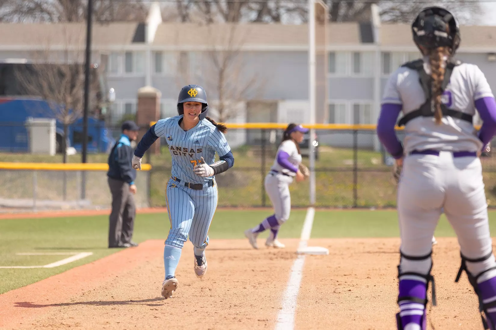Kansas City Softball opened conference play by splitting a doubleheader with St. Thomas on March 23, 2024. The Roos won the first game, 3-2, and lost the second game, 8-1.