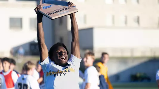 Nkumu with Summit League Regular Season Trophy