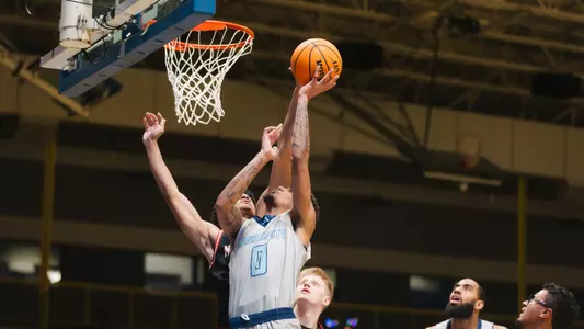 Karmello Branch takes the ball to the hoop against McPherson on Dec. 28, 2025