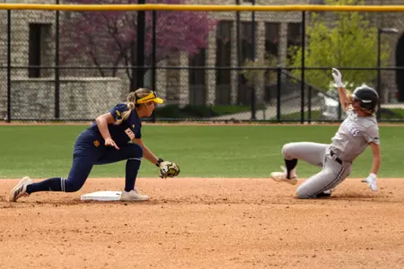 Bustamante Tagging Runner Out