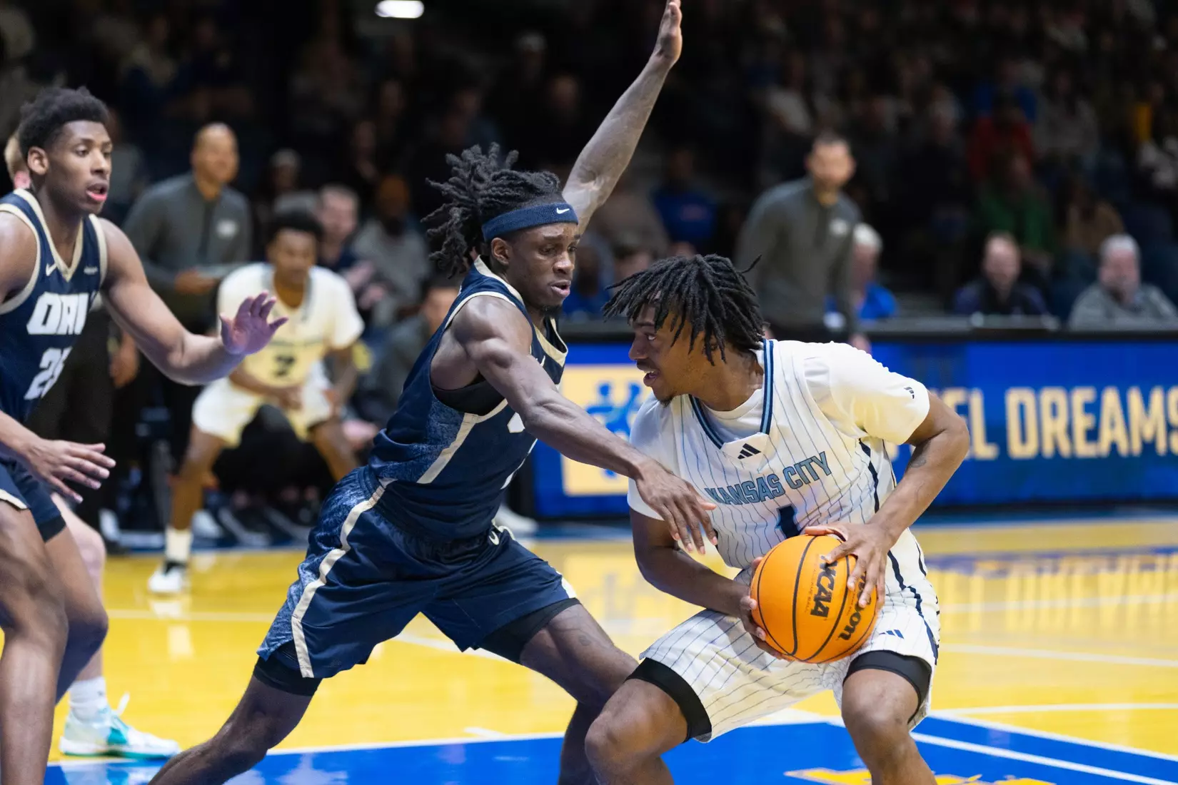 The Kansas City Roos wrapped up their home season on Senior Night in a powerful matchup against the Oral Roberts Golden Eagles, turning the arena into a celebration of resilience, pride, and Roos tradition. With a final score of 94–70 with the Golden Eagles winning, the night was about more than the scoreboard. It was about honoring the senior class for their leadership, commitment, and lasting impact on the program. From emotional pregame recognitions to high-energy plays and a packed crowd filled with family, friends, and fans. As the Roos close the chapter on their home season, their focus now shifts to postseason play as they head into the Summit League Tournament, carrying momentum, unity, and Roos pride into championship season.