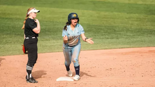 Leilani Bustamante celebrates after hitting a double against Brown