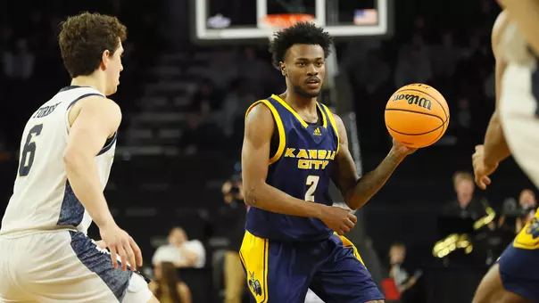 CJ Evans looks to make a pass in the Roos' Summit League First Round game against Oral Roberts