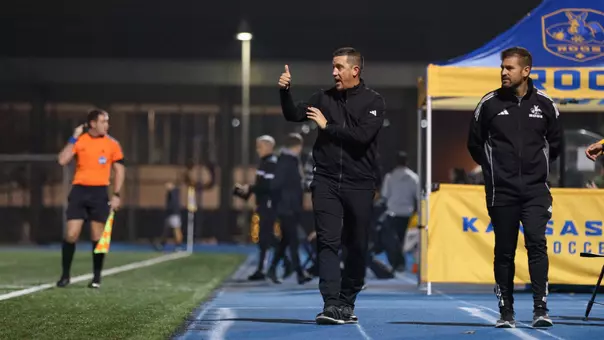 Head Coach Ryan Pore directs the team from the sidelines during the Roos' NCAA Tournament game against Lindenwood