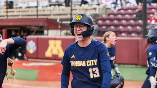 Katie Noble celebrates after scoring a run against South Dakota