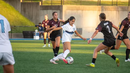 Olivia Orosco splits between a pair of Missouri State defenders