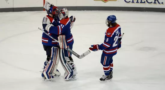 Doug Carr & Brian Robbins congratulate Connor Hellebuyck 11/14/13