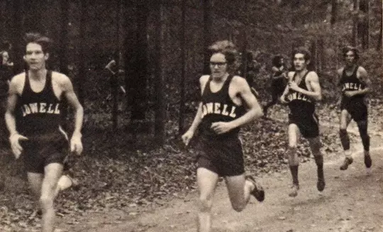 Runners runnings in the forest wearing Lowell jerseys.