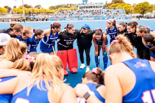 Field Hockey team huddling pregame