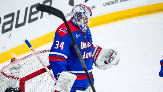 Cole Moore Holding Puck in Glove at Colgate