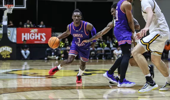Darrel Yepdo dribbling around a defender at UMBC