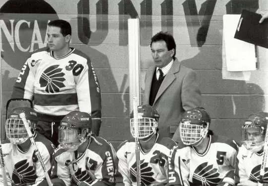 Billy Riley coaching on the bench
