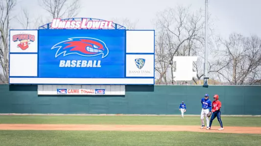 Edward A. LeLacheur Park with a videoboard in the back of the field, and baseball players on the ballpark playing baseball
