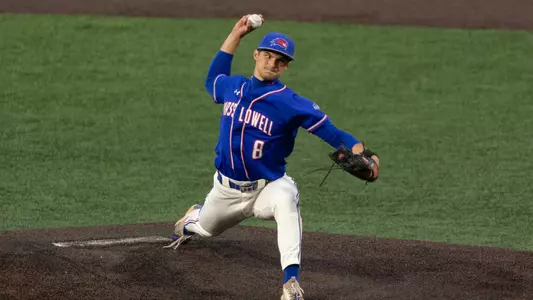 UMass Lowell baseball pitcher on the mound about to throw a pitch down the strike zone to a batter