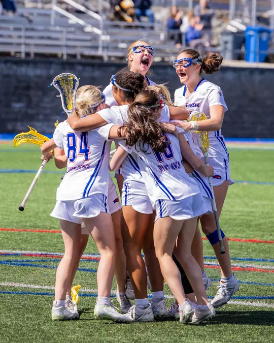 WLAX Celebrating OT win vs. UMBC