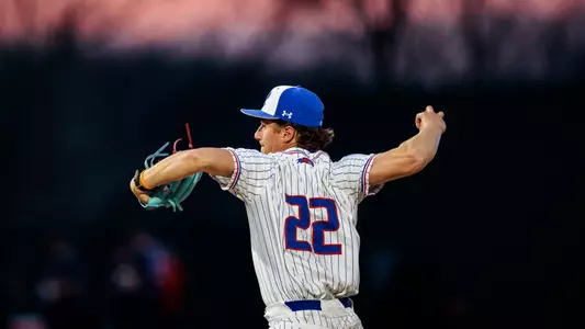 UMass Lowell baseball pitcher getting ready to throw the ball on the mound down the strike zone to an opposing batter
