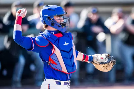 UMass Lowell Baseball - catcher Scott Donahue behind the plate throwing the ball