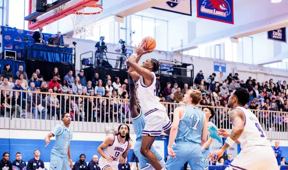 Victor Okojie taking a layup against Maine