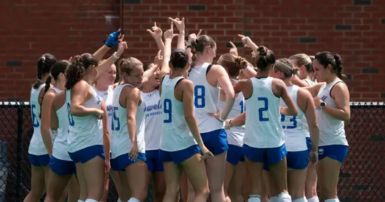 field hockey team huddle