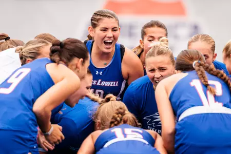 Field Hockey team huddling