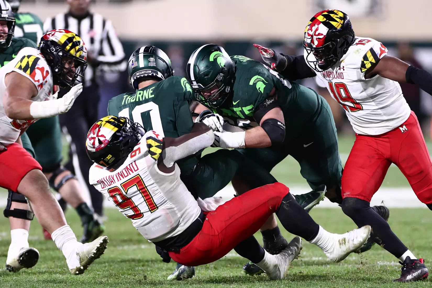 Defensive line Sam Okuayinonu (97) sacks the Michigan State quarterback.
Maryland Terrapins vs. #8 Michigan State Spartans at Spartan Stadium in East Lansing, MI on Saturday, Nov. 13, 2021.
Maddie Kyler/Maryland Terrapins