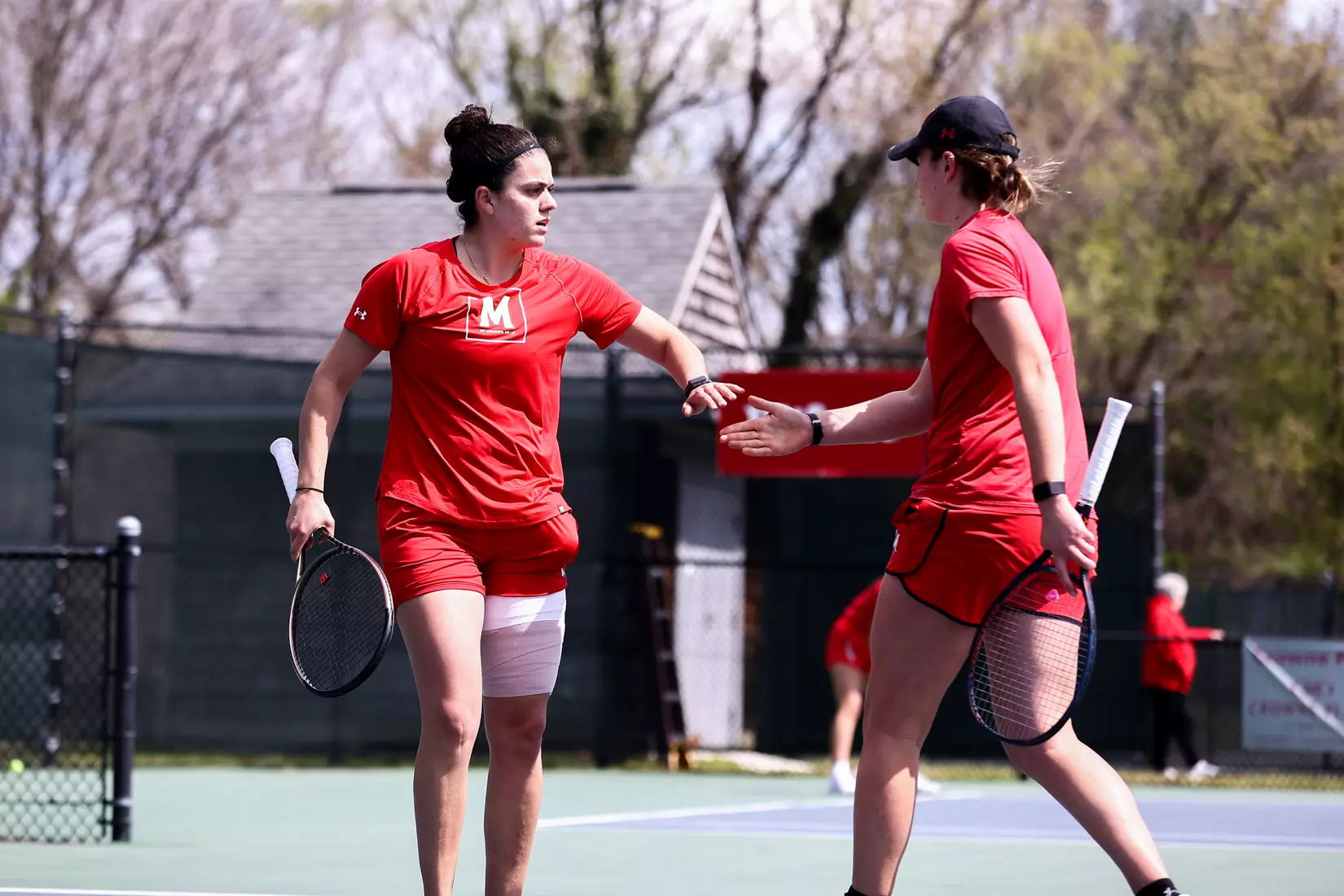 Marta Perez Mur and Jojo Bach. Maryland Terrapins vs. Minnesota Golden Gophers in College Park, MD on April 3, 2022. Taylor McLaughlin/Maryland Athletics