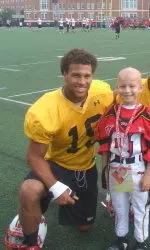 Quarterback Lends Helping Hand To Children In Need