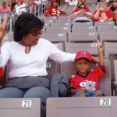 Dino Tomlin as a youth at a Bucs game
