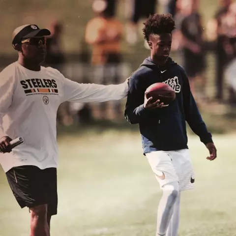 Dino Tomlin with his dad in high school
