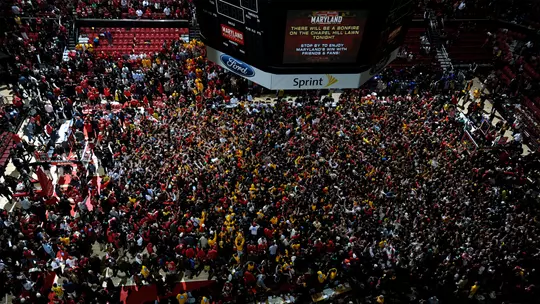 Fans storm the court in 2013 Men's Basketball vs. Duke