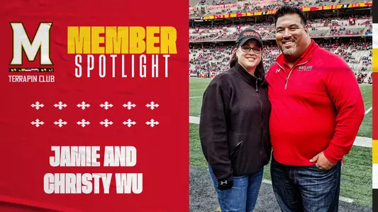 Jamie and Christy on the field before a Maryland Football game