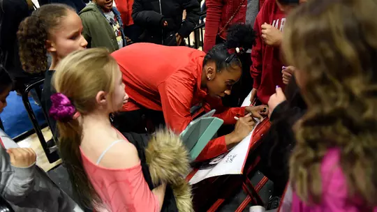 Tiara Wright signs autographs for young fans