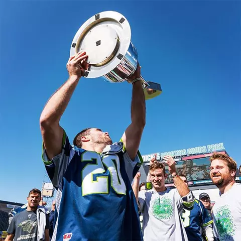 Nick Manis with the MLL trophy