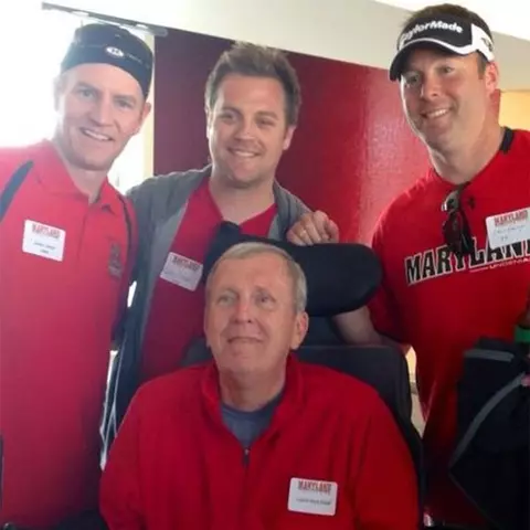Jason Carrier with teammates and Coach Dick Edell at a reunion