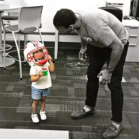 Jordan Steffy with his daughter in a Maryland football helmet