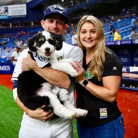 Brandon and Madison Lowe with their pup at a Tampa Bay Rays game