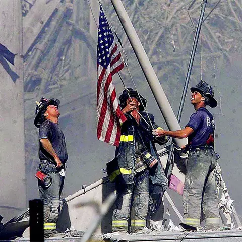 Sept. 11, 2001 Firefighters raise the American Flag