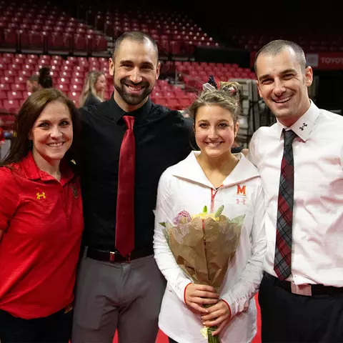Megan McClelland with coaches on Senior Day