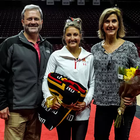 Megan McClelland with parents on Senior Day