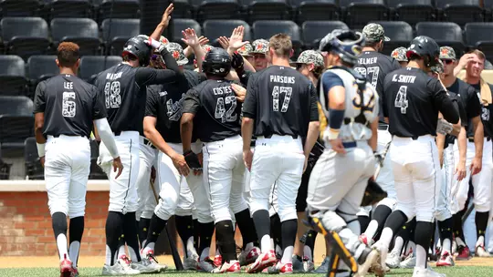 2017 Baseball team celebrating at NCAA Regionals
