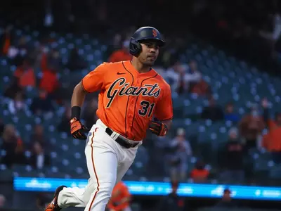LaMonte Wade Jr. rounding the bases